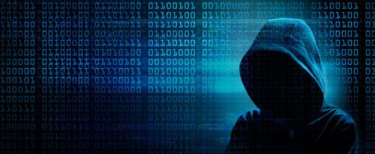 A shadowed and hooded figure stands out in the corner of a string of binary columns